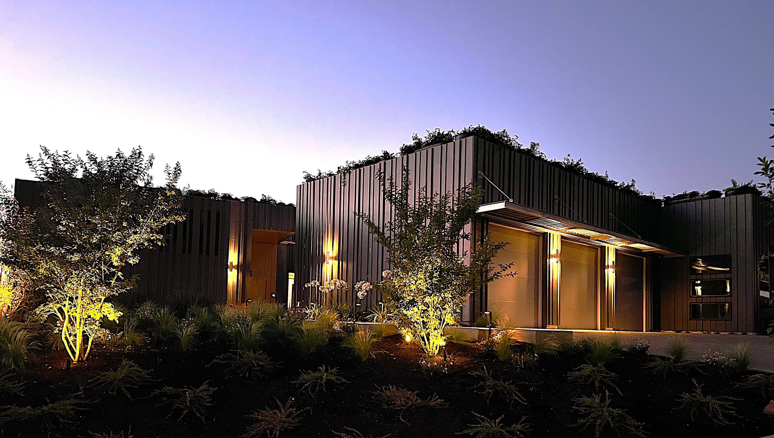 Creekside Homes Street of Dreams home at twilight in Oregon wine country