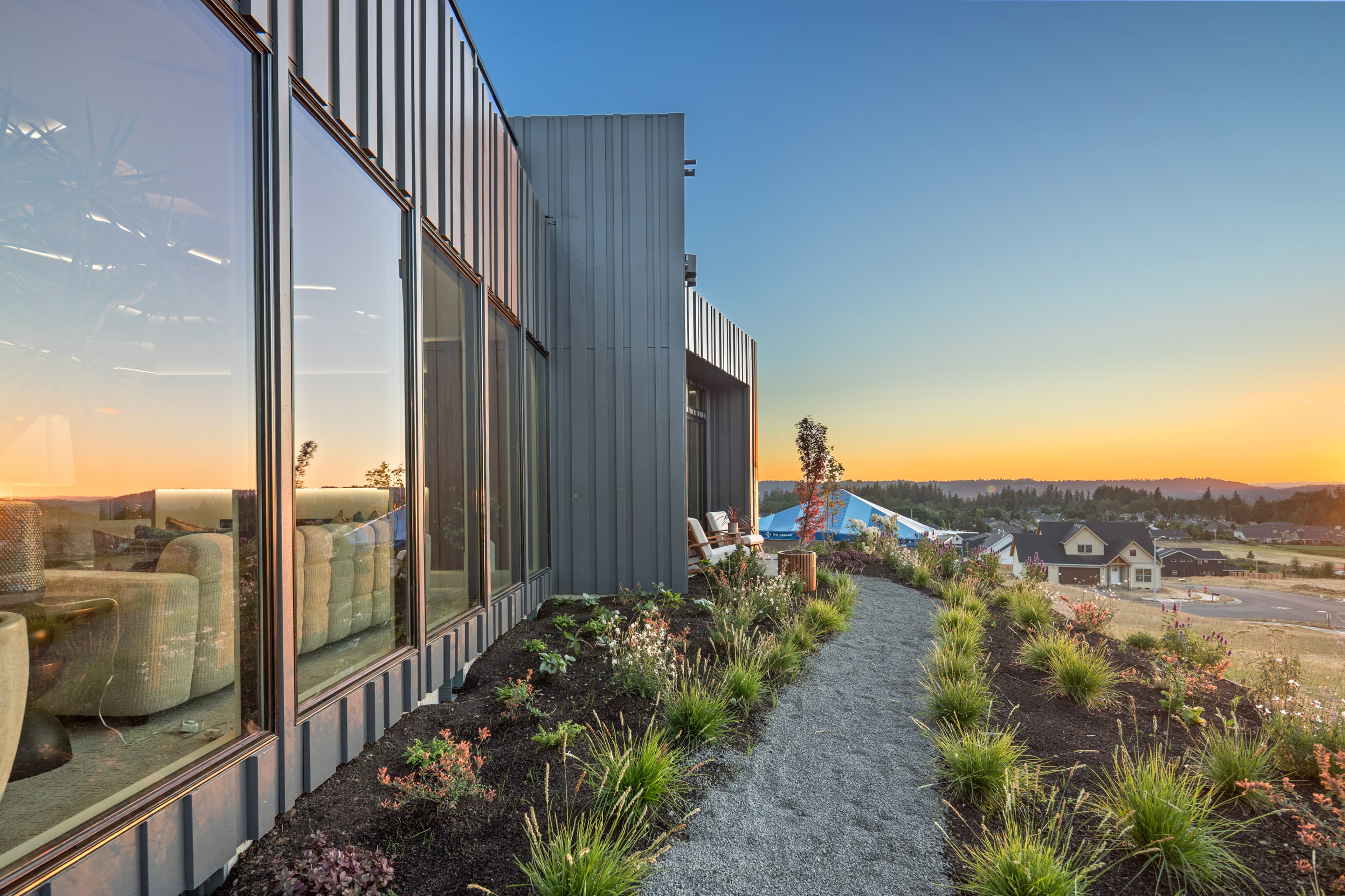 Creekside Homes Street of Dreams custom home at dusk in Oregon wine country